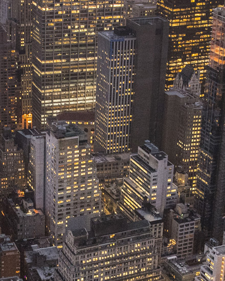 An aerial view of tall city buildings.