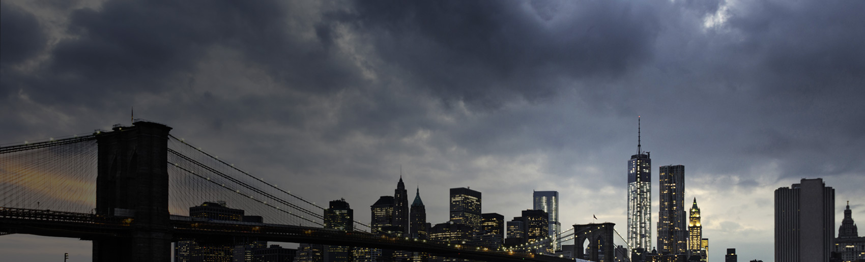 A view of New York City with storm clouds in the background