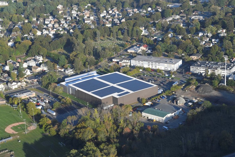 A building with solar panels installed on the roof.