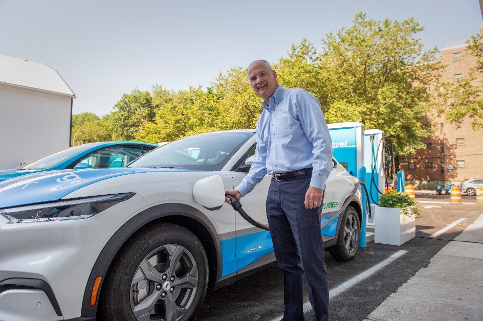 The Con Edison CEO charging an electric car.
