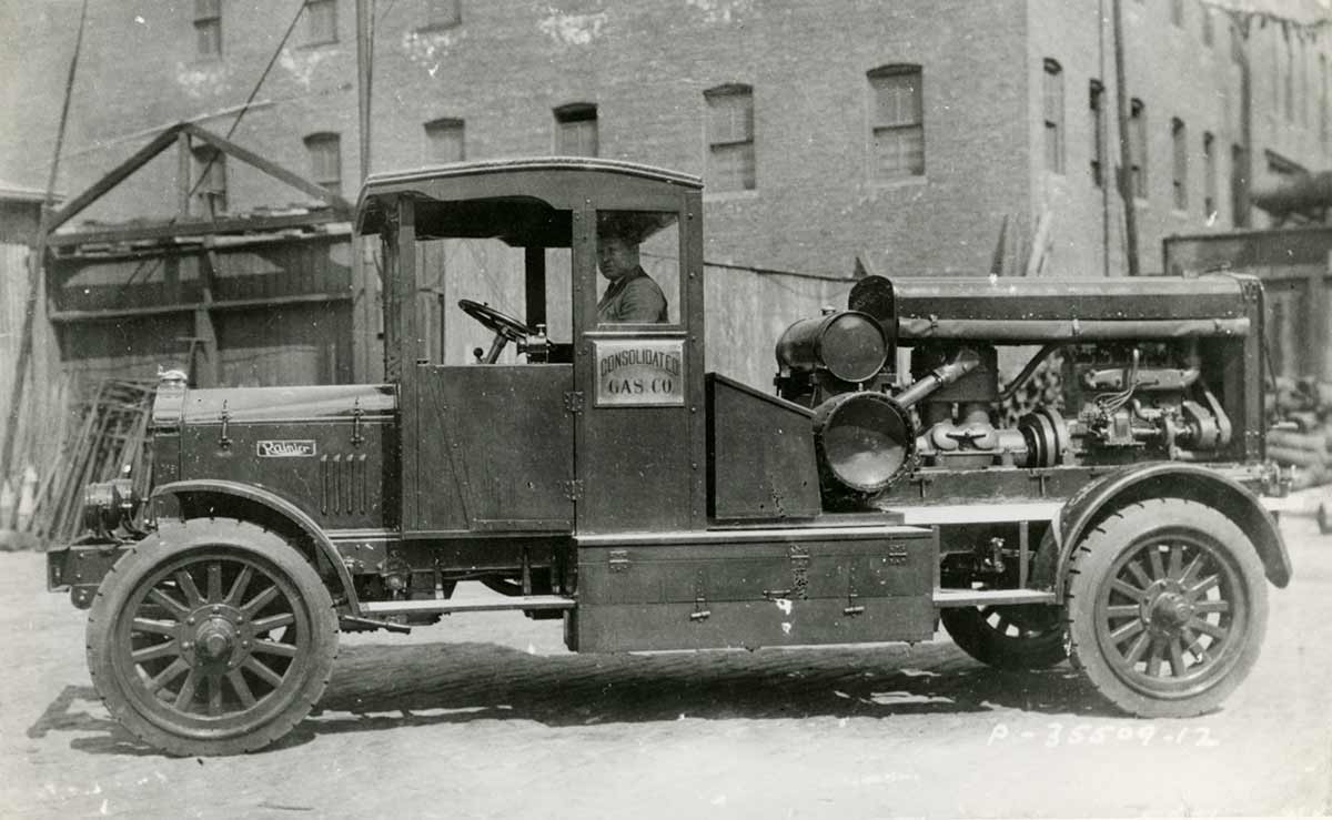 Historic photo of a man driving a Con Edison work truck.