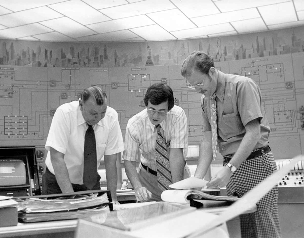 Black and white photo of Con Edison employees at an energy control center.