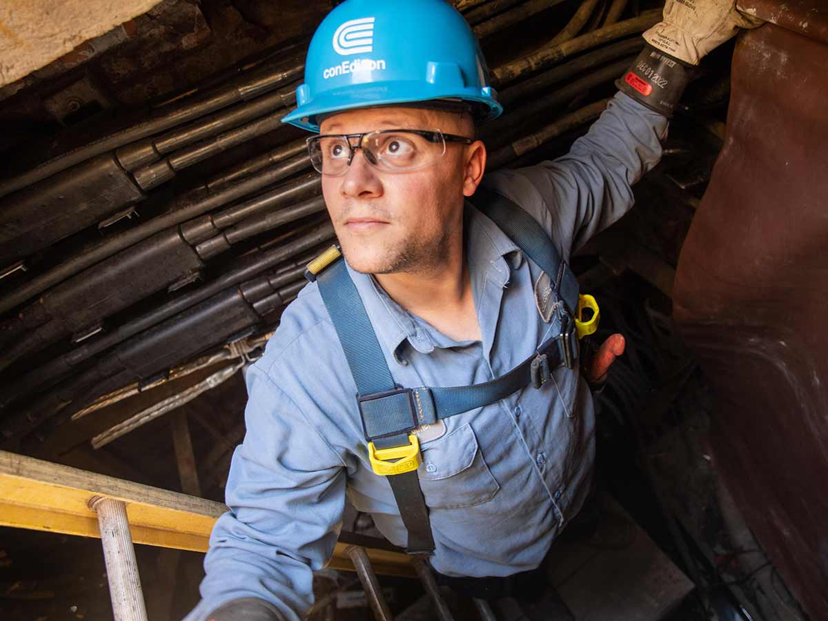 A Con Edison employee inspects underground electric equipment in Manhattan.