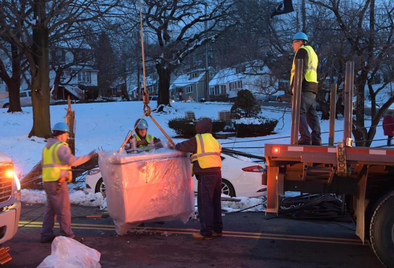 Con Edison employees working during the evening to repair damage from the Riley-Quinn storm events. 