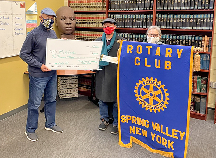 Three key leaders in this year’s Spring Valley Rotary Winter Holiday Coat Drive show the $2,000 they raised in the community. From left, they are: Nathan Mungin, the Executive Director at the Martin Luther King Center, Ryan O’Gorman from the Pearl River Rotary Club and Julie Prevost, the President of the Spring Valley Rotary Club.  